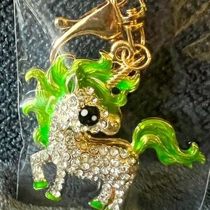 Clear gemstone with green and black unicorn key chain with gold hoop